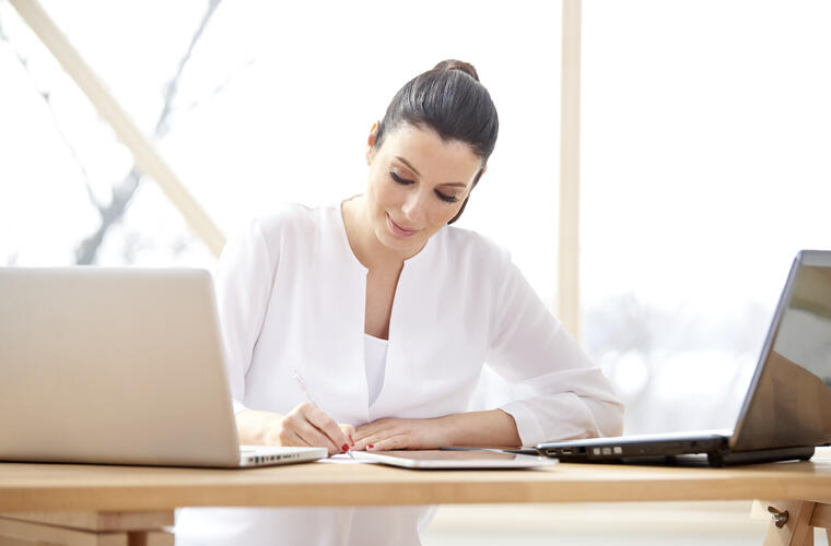 bigstock Businesswoman Working On Lapto 239551429