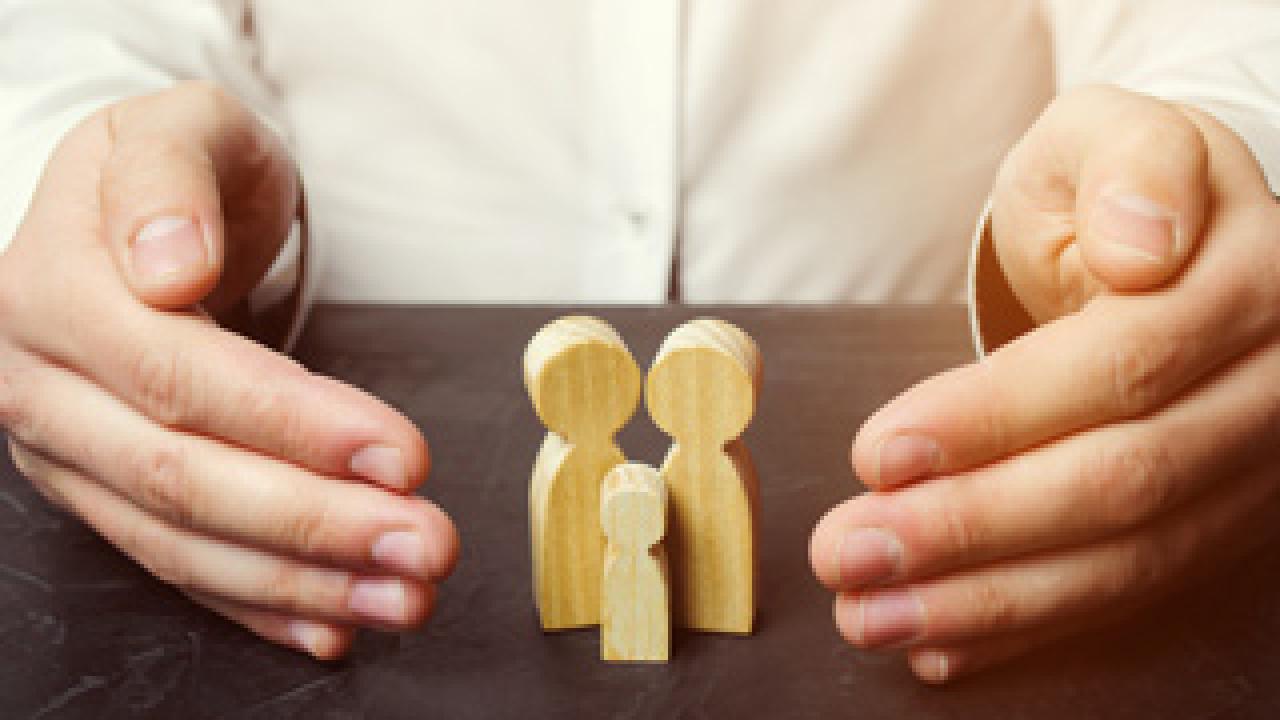 bigstock Insurance Agent Holds Hands Ov 271616056