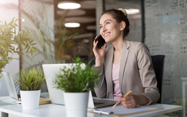 bigstock Young business woman working o 305139460